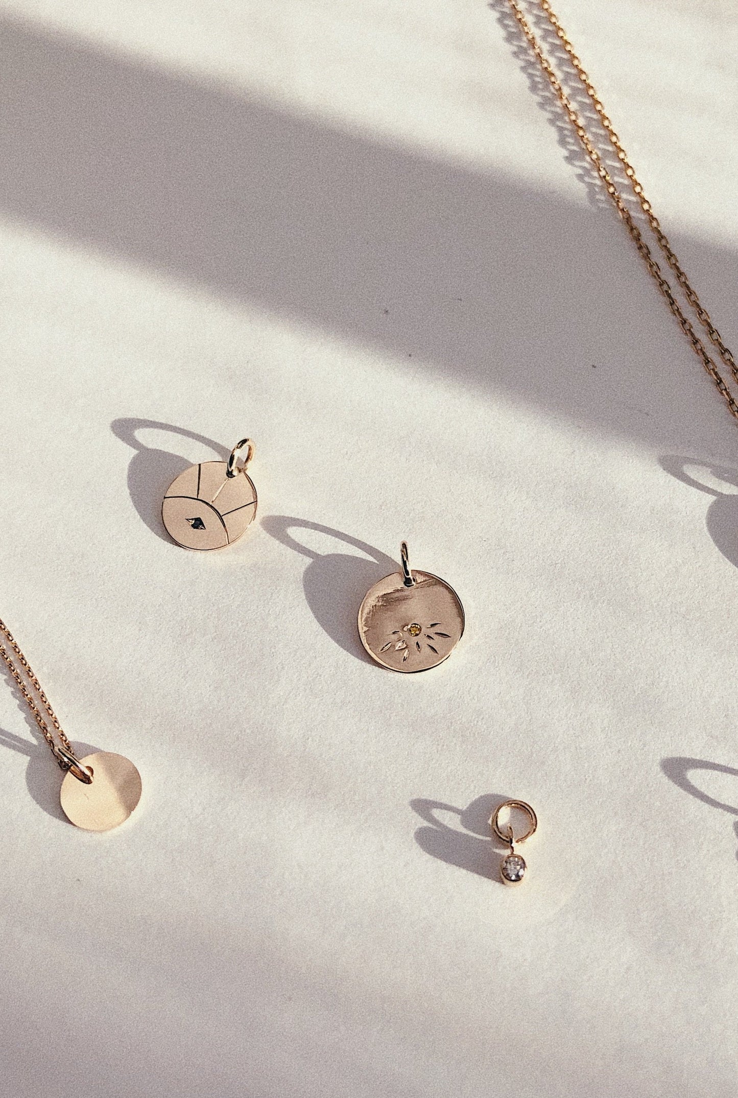 Charms and pendants in solid gold handmade by Adriana Chede Jewellery